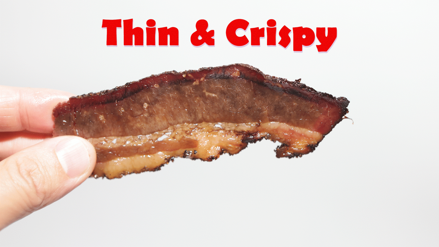 thin and crispy brisket chip in hand rotating